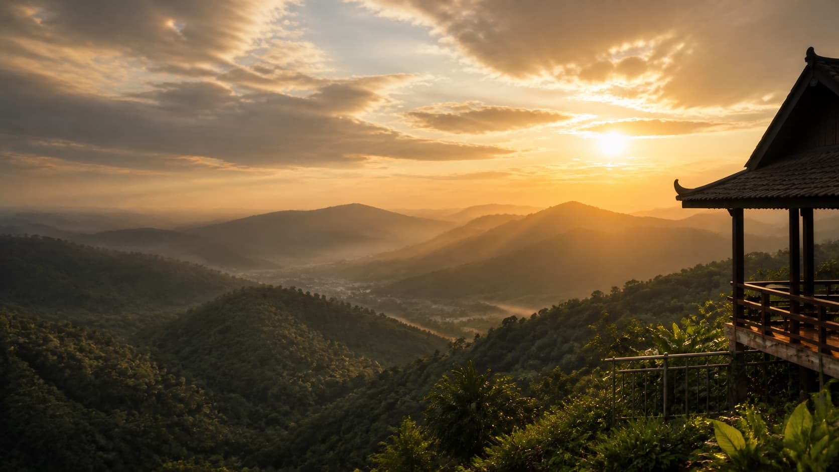 Layered Malaysian mountains in warm sunrise light